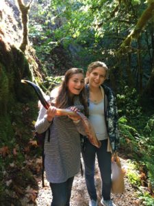Lauren and Ari carry a shofar through the woods during a leafy Rosh Hashanah prayer session.