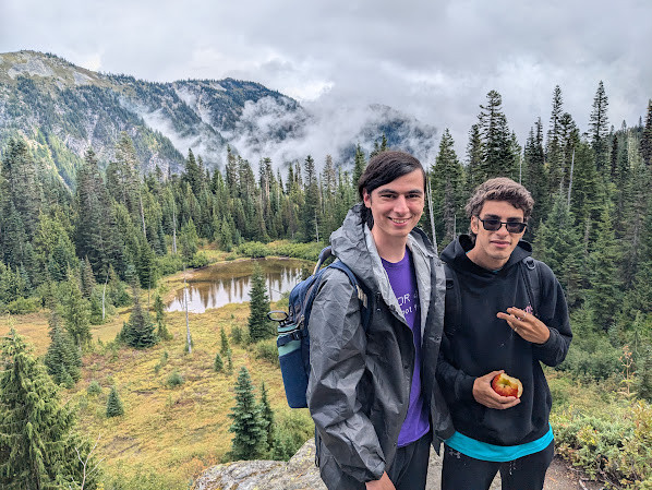 Me and a housemate posing in front of a pond on our second hike
